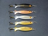 Mighty Minnows concave shape metal lure with a treble hook, crane swivel