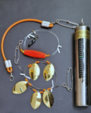 Our downrigger system includes thermometer weight, 1 tuff mutha snubber, stacker release and blade troll